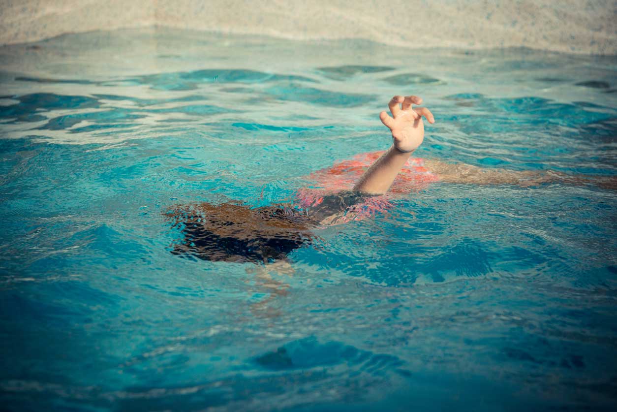 person sinking underwater