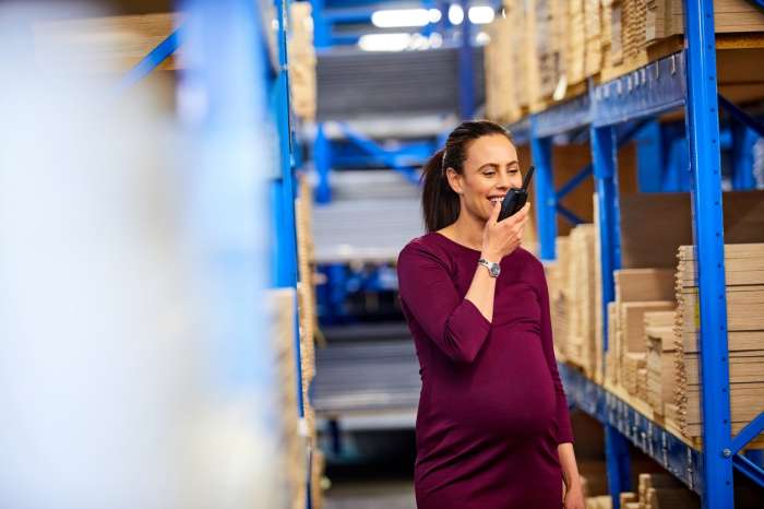 pregnant woman working at a physically strenuous job